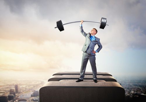 Image of strong businessman lifting barbell above head with one hand