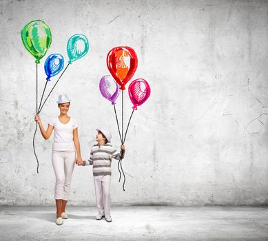 Image of young happy smiling family walking