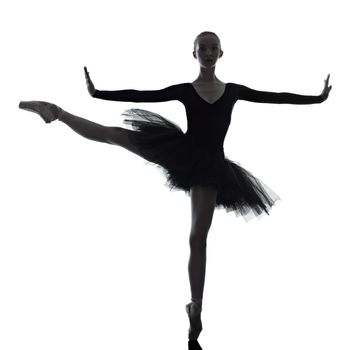 one caucasian young woman ballerina ballet dancer dancing with tutu in silhouette studio on white background