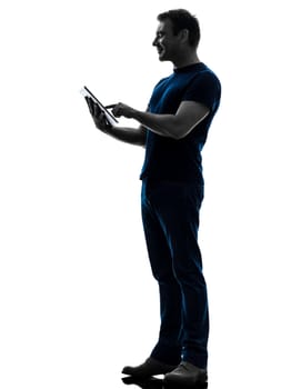 one caucasian man touchscreen digital tablet   in silhouette on white background