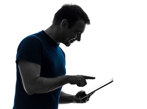 one caucasian man touchscreen digital tablet   in silhouette on white background