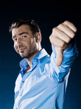 one caucasian man unshaven thumb down portrait isolated studio on black background