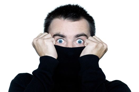 one caucasian shy man surprised anonymous hiding behind his pull over expressive portrait on studio isolated white background