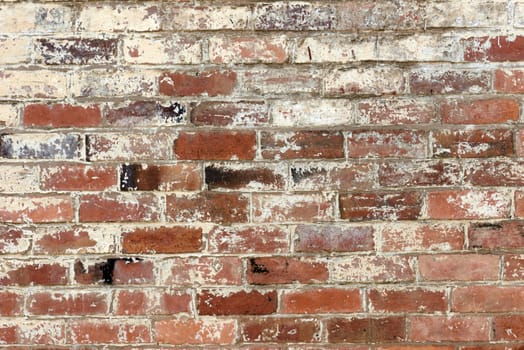 old brick wall texture background with worn off paint