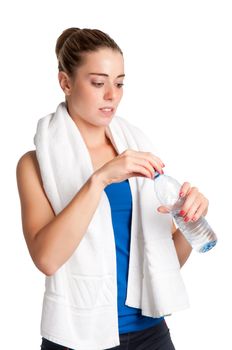 Woman about to drink water from a plastic bottle, isolated in white