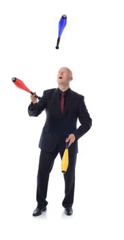 Man in suit juggling concept of multitasking