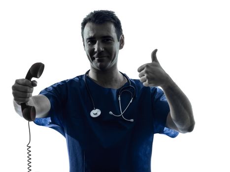 one caucasian man doctor surgeon medical worker  holding phone thumb up gesture silhouette isolated on white background