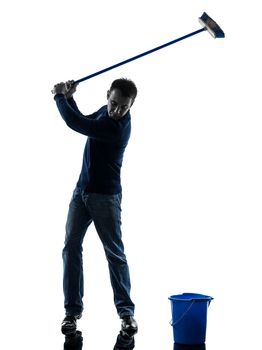 one caucasian man janitor brooming cleaner  golfing full length in silhouette studio isolated on white background