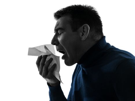 one caucasian man sneezing portrait in silhouette studio isolated on white background