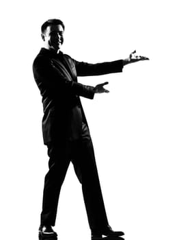 silhouette caucasian business man  expressing  showing gesture introducing presentationsimiling  behavior full length on studio isolated white background