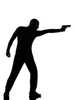 thief criminal terrorist man aiming gun in silhouette studio isolated on white background