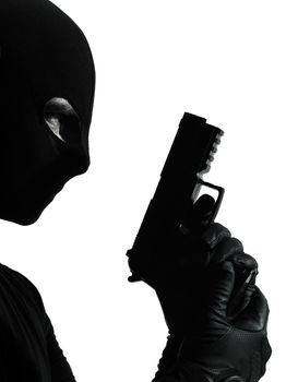 thief criminal terrorist holding gun portrait in silhouette studio isolated on white background