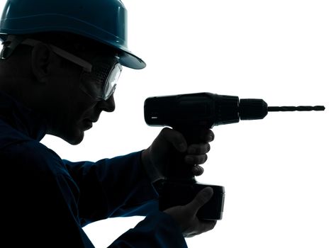 one caucasian man construction worker holding drill silhouette in studio on white background