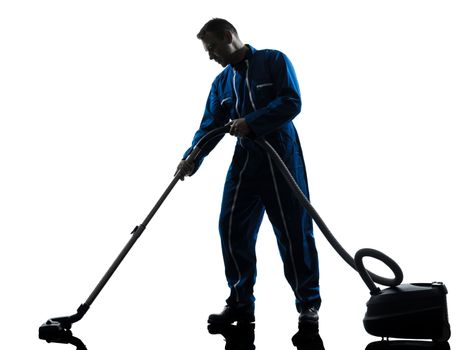 one caucasian janitor vaccum cleaner cleaning silhouette in studio on white background