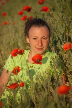 Young beautiful woman on cereal field in summer