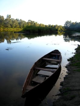 image of beautiful landscape with river and boat in the evening