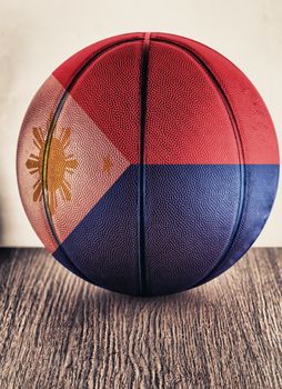 Close up of an old leather basketball with Philippines flag