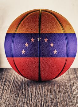 Close up of an old leather basketball with Venezuela flag