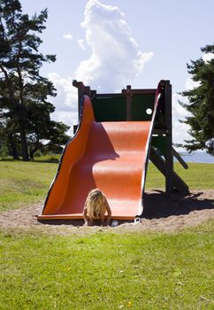 An abandoned girl crying on a swing