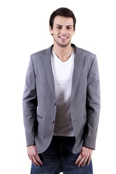 View of a young man standing against a white  background. 