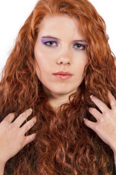View of a beautiful young natural red hair woman isolated on a white background.