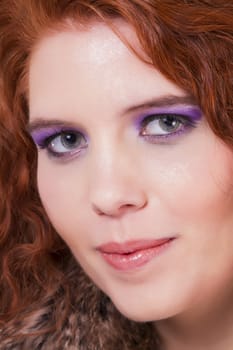 View of a beautiful young natural red hair woman isolated on a white background.