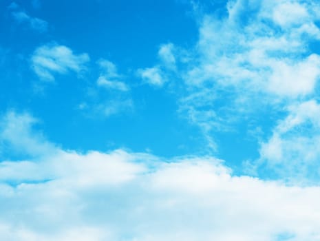 blue sky background with tiny clouds