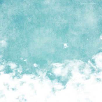 Sky, fog, and clouds on a textured, vintage paper background with grunge stains