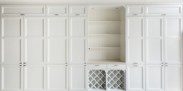 White vintage cupboard with shelf