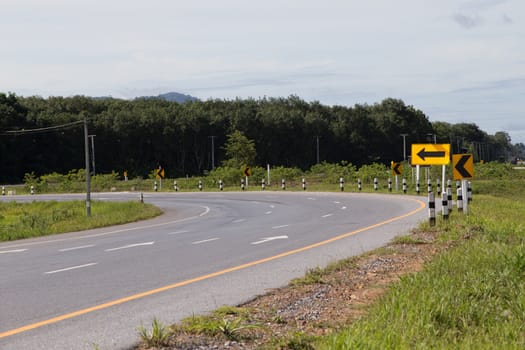 traffic sign for curved road in yala, thailand