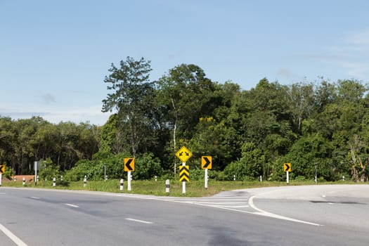 traffic sign of split road in yala, thailand