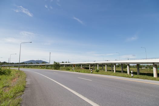 road and highway in yala, thailand with blue sky