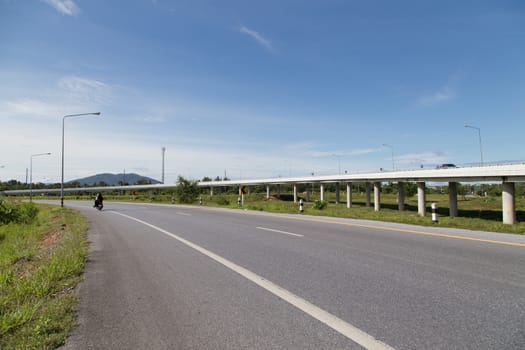 road and highway in yala, thailand with blue sky