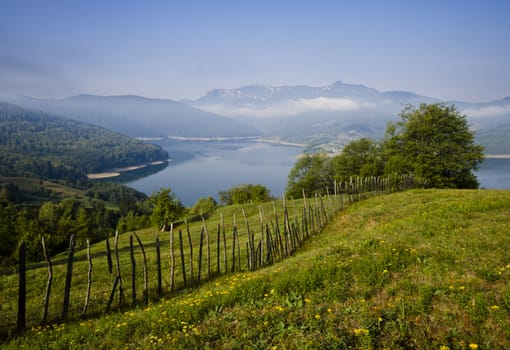 rural scene of mountain and lake at summer, Romanian Carpathians