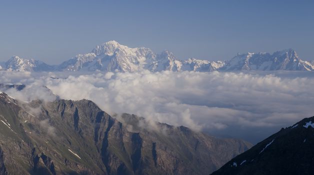 Mont Blanc summit of Europe Alps above clouds