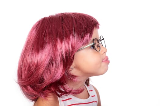 portrait of a beautiful little girl with a wig
