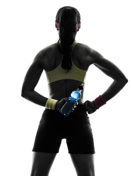 one  woman exercising fitness holding energy drink rear view in silhouette  on white background