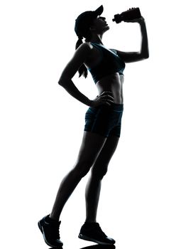 one caucasian woman runner jogger drinking in silhouette studio isolated on white background