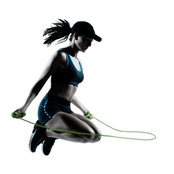 one caucasian woman runner jogger jumping rope in silhouette studio isolated on white background