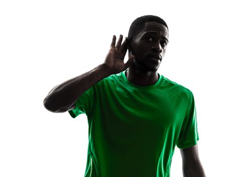 one african man soccer player green jersey hearing gesture  in silhouette  on white background