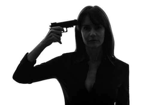 one caucasian sexy detective  woman holding aiming  gun in silhouette studio isolated on white background