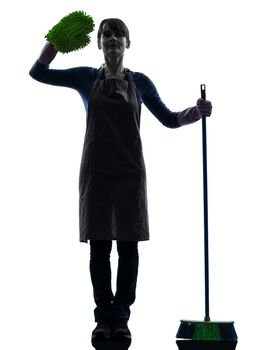 one caucasian woman maid saluting brooming   in silhouette studio isolated on white background