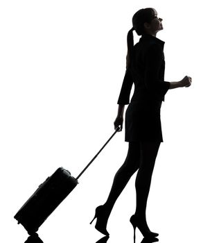 one business woman traveler walking   silhouette studio isolated on white background