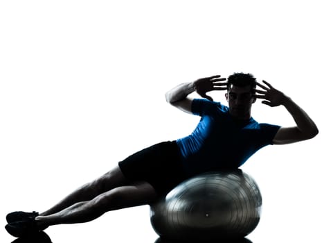 one caucasian man exercising workout fitness ball in silhouette studio  isolated on white background
