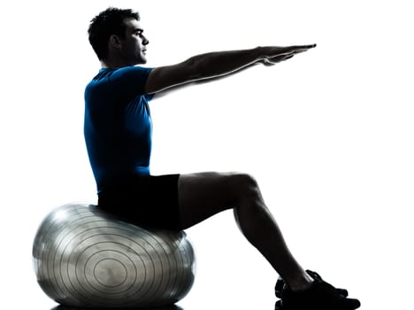 one caucasian man exercising workout fitness ball in silhouette studio  isolated on white background