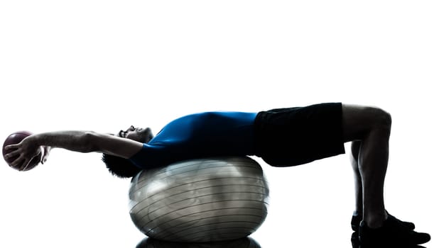 one caucasian man exercising workout fitness ball in silhouette studio  isolated on white background