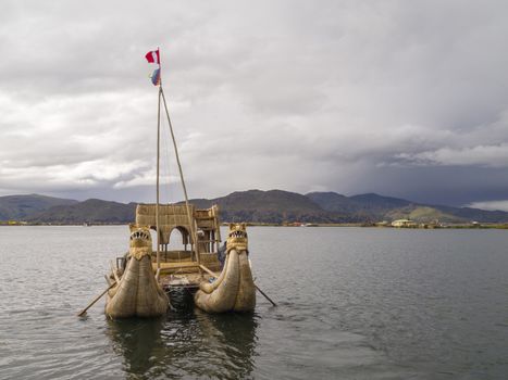Old traditional floating reed boat in Titicaca lake, Puno, Peru.