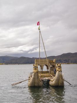 Old traditional floating reed boat in Titicaca lake, Puno, Peru.