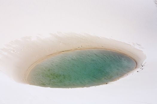 view of lagoa azul in desert sand dunes of the Lencois Maranheses National Park in brazil