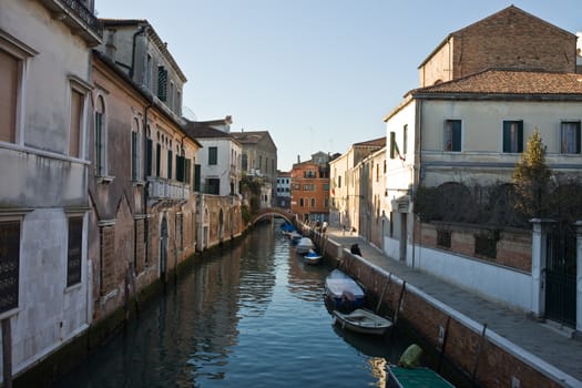 along small canal in the beautiful city of venice in italy